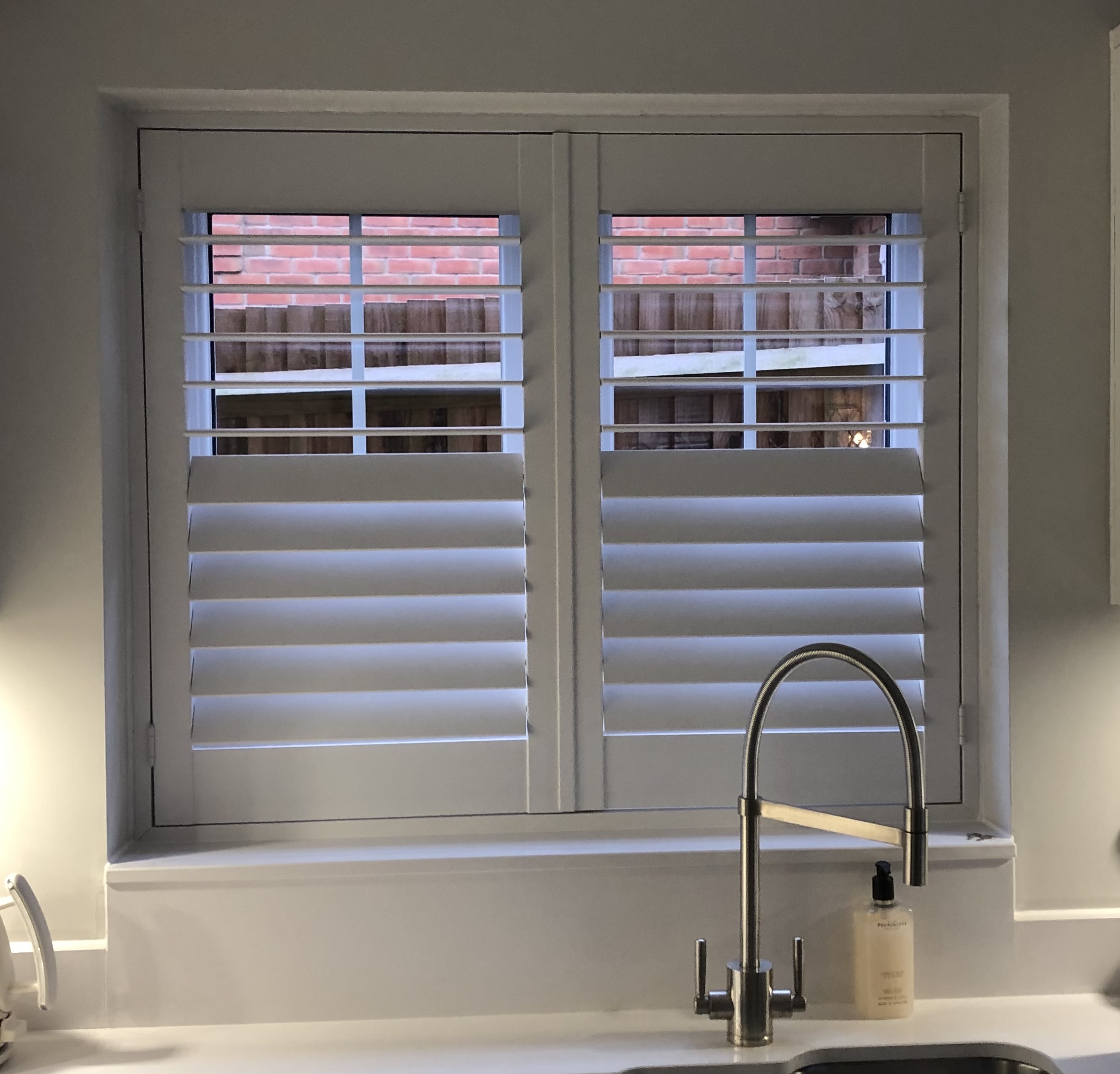 Kitchen window shutters above sink